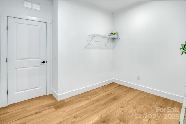 interior space with light wood-type flooring and visible vents