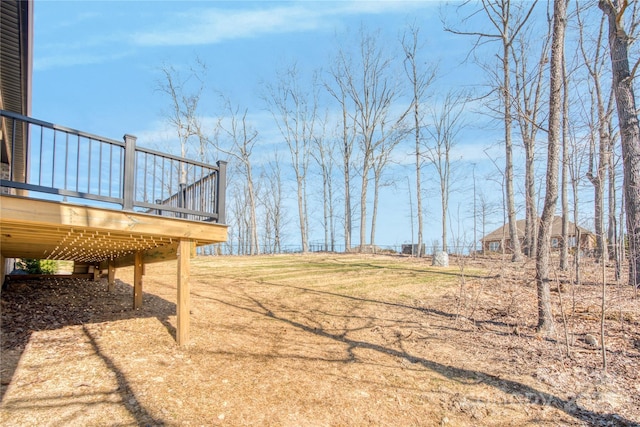 view of yard with a wooden deck