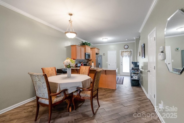 dining area featuring baseboards, dark wood finished floors, and ornamental molding