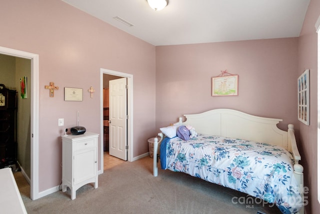 bedroom featuring light carpet, baseboards, and visible vents