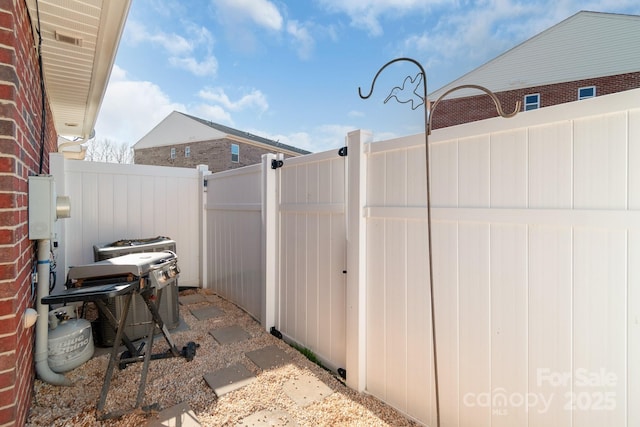 view of patio featuring fence and central air condition unit