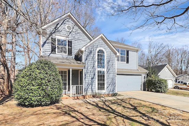 traditional-style home with a garage and driveway