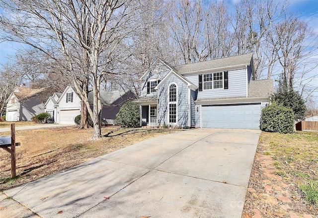 traditional-style home with concrete driveway and an attached garage