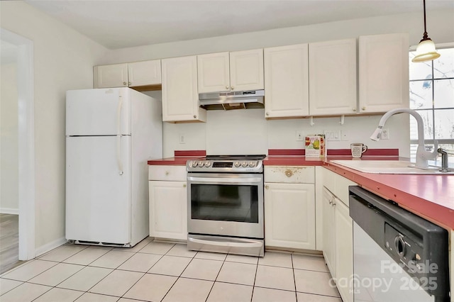 kitchen with light tile patterned floors, appliances with stainless steel finishes, under cabinet range hood, white cabinetry, and a sink