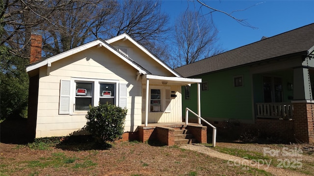 bungalow with roof with shingles