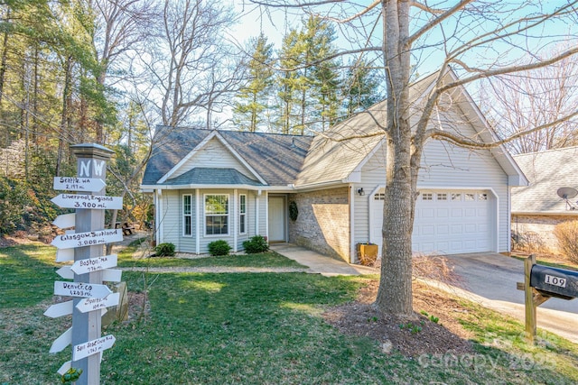 view of front of house featuring a garage, driveway, brick siding, roof with shingles, and a front yard