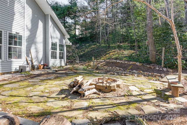 view of yard with a fire pit