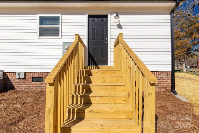 view of exterior entry featuring crawl space