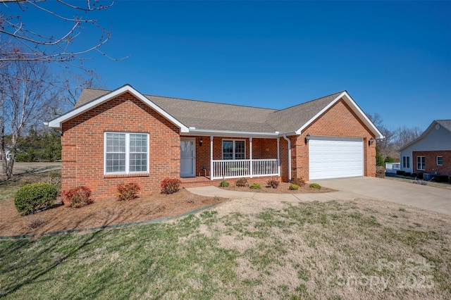 ranch-style house featuring a garage, concrete driveway, covered porch, a front lawn, and brick siding