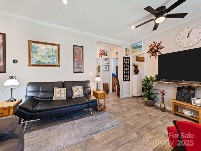 living room with crown molding, recessed lighting, a ceiling fan, wood finished floors, and baseboards