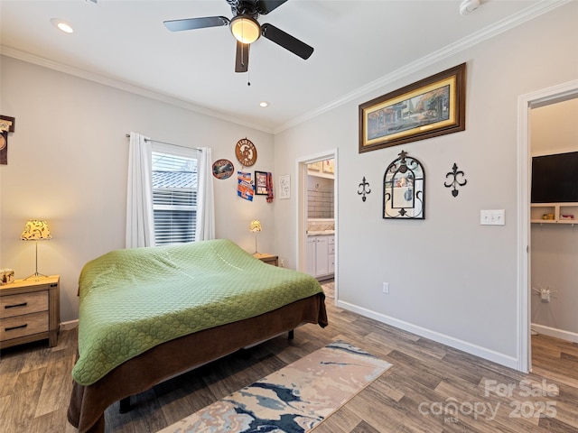 bedroom featuring ornamental molding, recessed lighting, wood finished floors, and baseboards