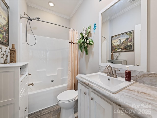 full bath with crown molding, toilet, shower / bath combo with shower curtain, vanity, and wood finished floors