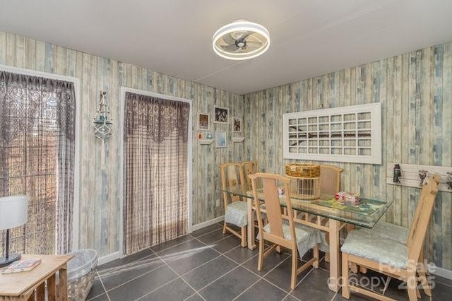 dining area featuring tile patterned flooring and baseboards