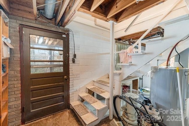 interior space featuring water heater and stairway