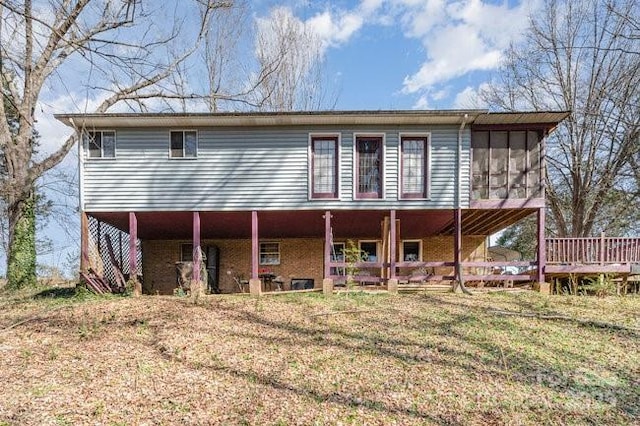 back of house with a sunroom