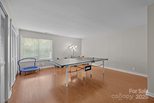 playroom with light wood finished floors and baseboards