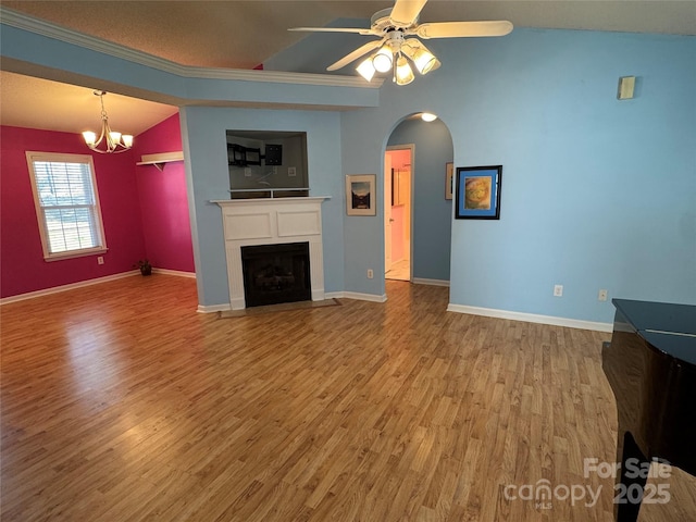 unfurnished living room featuring baseboards, a fireplace with flush hearth, and wood finished floors