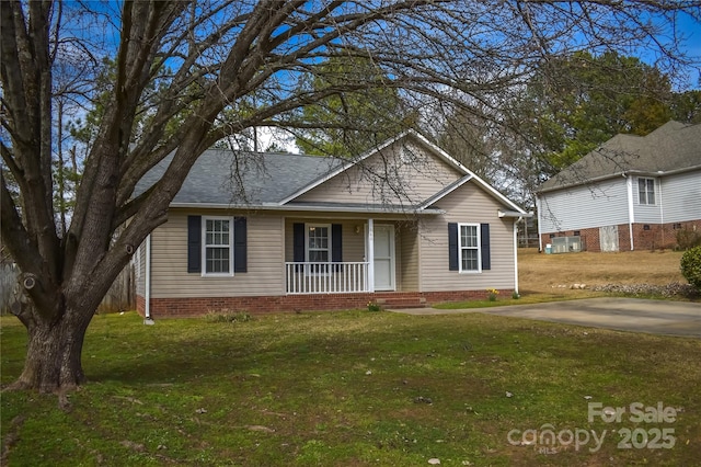 single story home featuring a front yard and covered porch