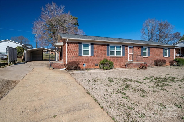 ranch-style house featuring brick siding, a shingled roof, concrete driveway, crawl space, and a carport