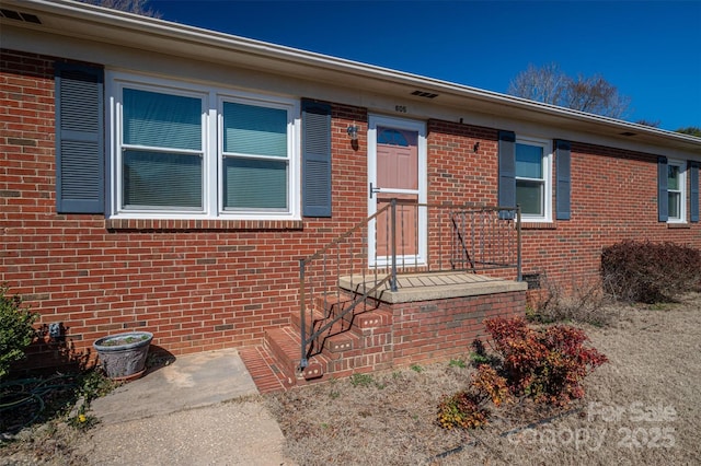 view of front of house with brick siding