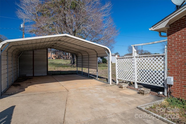 view of parking with a carport and driveway