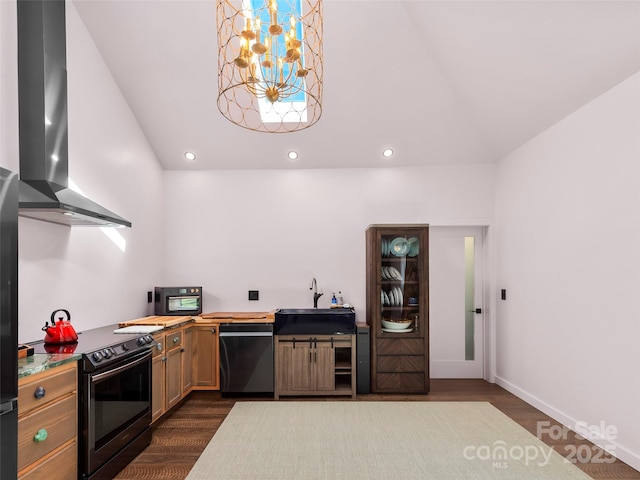 kitchen featuring a sink, black appliances, wall chimney exhaust hood, and dark wood finished floors