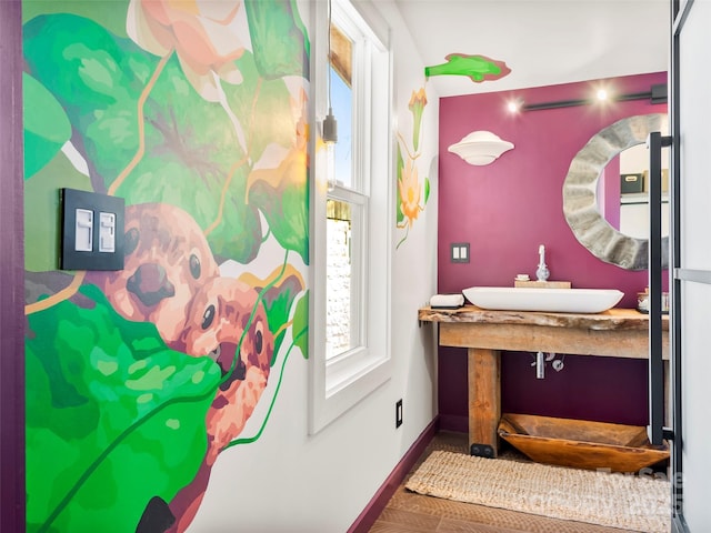 bathroom with baseboards and a sink