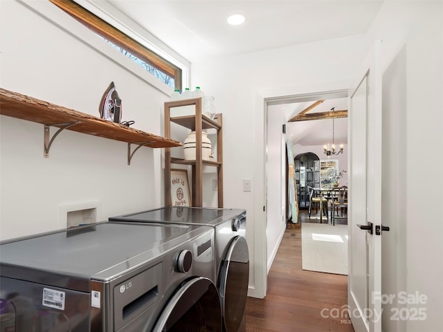 washroom with laundry area, dark wood-type flooring, washer and dryer, a notable chandelier, and recessed lighting