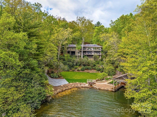 3668 W Club Blvd, Lake Toxaway, NC 28747 - dock with a lawn, a wooded view, and a water view