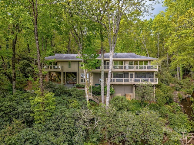 3668 W Club Blvd, Lake Toxaway, NC 28747 - back of house with a balcony and a wooded view