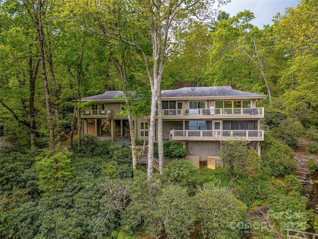 3668 W Club Blvd, Lake Toxaway, NC 28747 - back of house featuring a balcony, a wooded view, and stairs