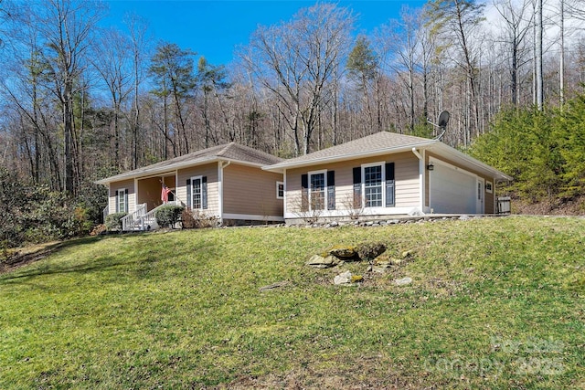 941 Wash Freeman Rd, Hendersonville, NC 28792 - ranch-style house with a porch, a front yard, and a garage
