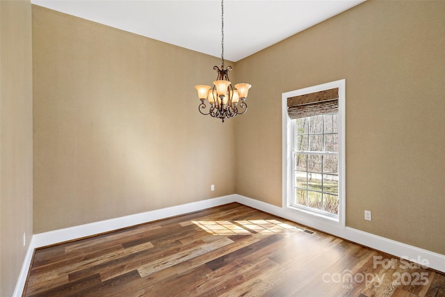 941 Wash Freeman Rd, Hendersonville, NC 28792 - unfurnished room featuring baseboards, wood finished floors, and a chandelier