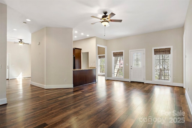 941 Wash Freeman Rd, Hendersonville, NC 28792 - unfurnished living room featuring a ceiling fan, dark wood-type flooring, baseboards, and recessed lighting