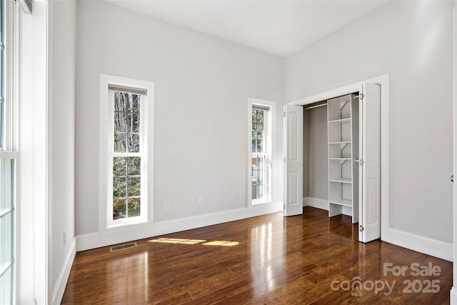 941 Wash Freeman Rd, Hendersonville, NC 28792 - unfurnished bedroom featuring wood finished floors and baseboards