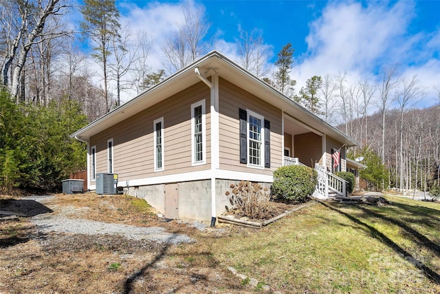 941 Wash Freeman Rd, Hendersonville, NC 28792 - view of property exterior with central air condition unit, a lawn, and a porch