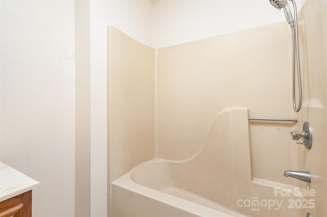 full bathroom featuring vanity and bathing tub / shower combination