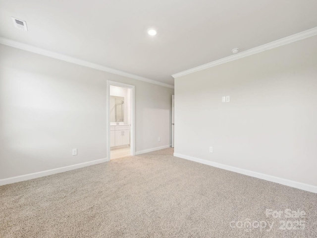 spare room featuring light carpet, visible vents, baseboards, crown molding, and recessed lighting