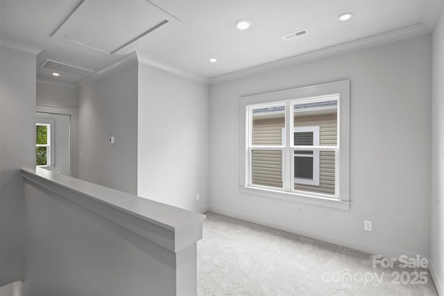 empty room featuring crown molding, carpet, visible vents, and recessed lighting