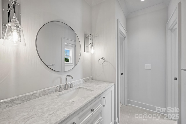 bathroom with tile patterned flooring, vanity, and baseboards