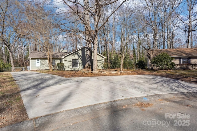 view of property exterior featuring driveway