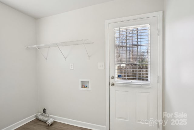 laundry room with washer hookup, laundry area, baseboards, and wood finished floors