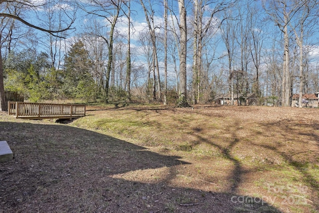 view of yard with a wooden deck