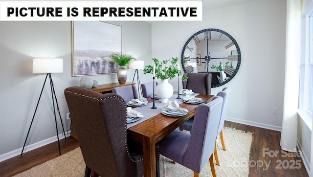 dining space with baseboards and wood finished floors