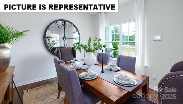 dining space with baseboards and wood finished floors