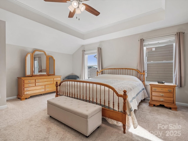 bedroom with ceiling fan, lofted ceiling, light colored carpet, baseboards, and crown molding