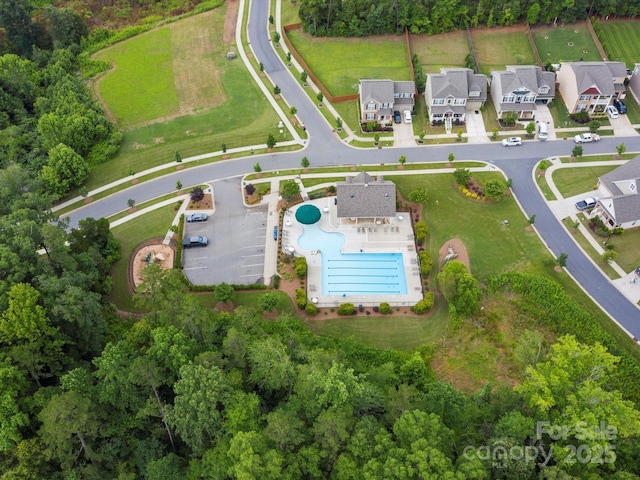 birds eye view of property with a residential view