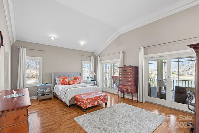 bedroom with baseboards, ornamental molding, wood finished floors, access to exterior, and vaulted ceiling