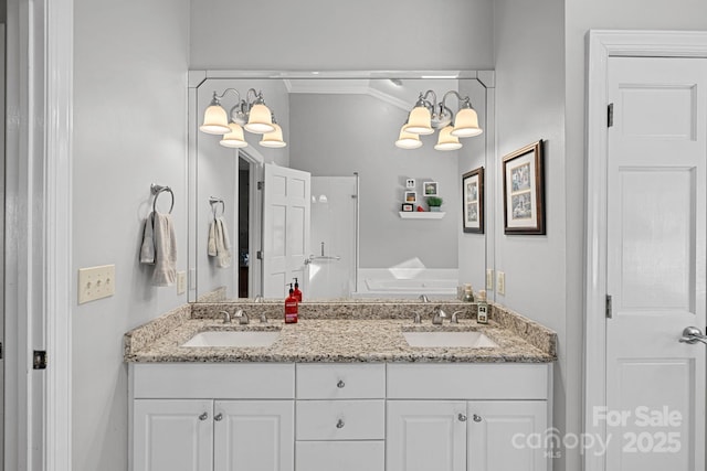 full bath with double vanity, ornamental molding, and a sink