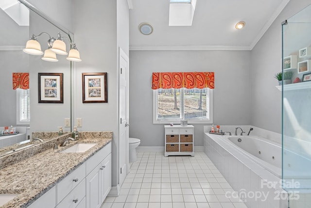 full bath featuring double vanity, ornamental molding, a jetted tub, and a sink